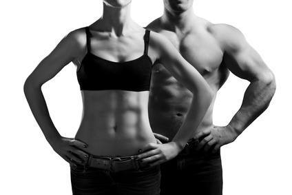 Bodybuilding. Strong man and a woman posing.